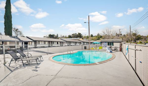 ENJOY THE FLORIDA SUNSHINE BESIDE THE POOL